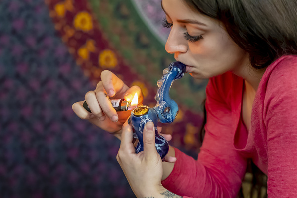 girl smoking herbal blend